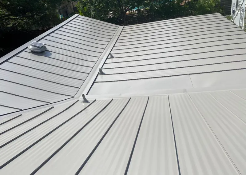 Solar attic fan installed on a metal roof for Roof Ventilation in Nephi